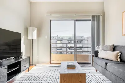a living room with a couch and a large window at N Hollywood 2BR w Gym Pool nr TJ Shops LAX-591 in Los Angeles
