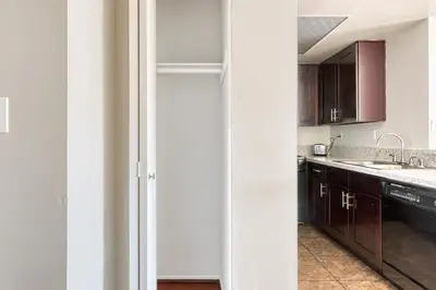 a kitchen with brown cabinets and a sink at N Hollywood 2BR w Gym Pool nr TJ Shops LAX-591 in Los Angeles