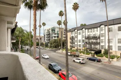 a view of a street with palm trees and cars at Beverly Hills 2BR near the Grove Rodeo Drive LAX-866 in Los Angeles