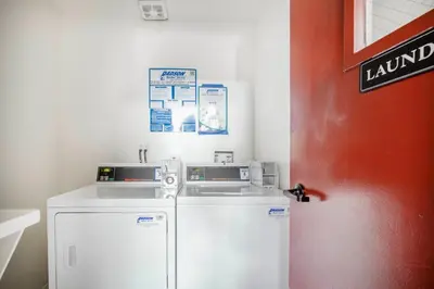 a small kitchen with a refrigerator and a wall at Beverly Hills 2BR near the Grove Rodeo Drive LAX-866 in Los Angeles