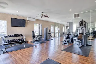 a gym with treadmills and exercise equipment in a room at Woodland Hills 2BR w Pool Gym nr Warner Center LAX-699 in Los Angeles