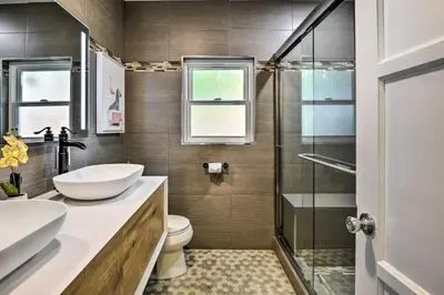 a bathroom with a toilet and a sink and a shower at San Gabriel Valley Hideaway! Family Home with Patio in Temple City
