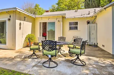 a patio with chairs and a table in front of a house at San Gabriel Valley Hideaway! Family Home with Patio in Temple City