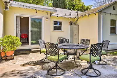 a patio with a table and chairs in front of a house at San Gabriel Valley Hideaway! Family Home with Patio in Temple City