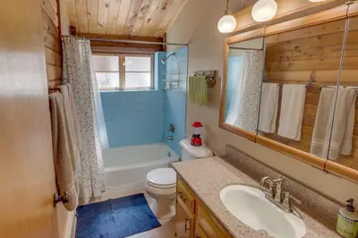 a bathroom with a sink and a toilet and a tub at Pine Mountain Club Cabin Rental with Pool Access! in Pine Mountain Club