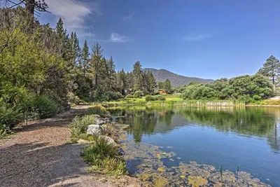 a view of a lake with trees and mountains at Pine Mountain Club Cabin Rental with Pool Access! in Pine Mountain Club