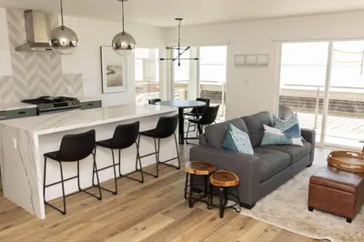 a kitchen and living room with a couch and a table at 5609 East Seaside Walk in Long Beach