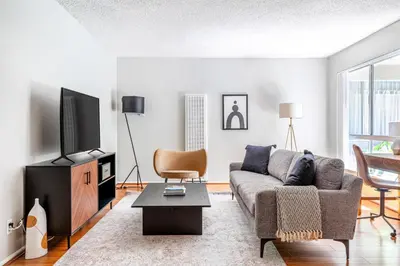 a living room with a couch and a tv at Sherman Oaks 1BR w Pool Gym BBQ nr TJ WF LAX-487 in Los Angeles