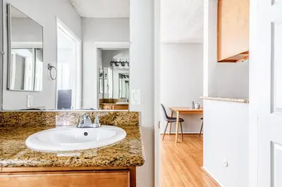 a bathroom with a sink and a mirror at Sherman Oaks 1BR w Pool Gym BBQ nr TJ WF LAX-487 in Los Angeles