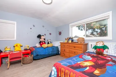 a bedroom with two beds with stuffed animals on it at Disneyland Paradise 6 BedRoom 4 Bathroom Pool Spa Games in Anaheim