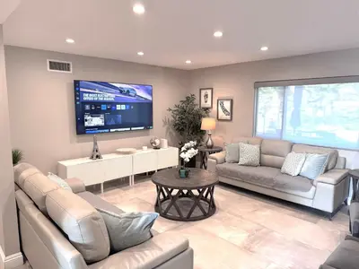 a living room with two couches and a tv at Cypress Villa Disneyland 8 Bedroom 4Bath Pool Game in Anaheim