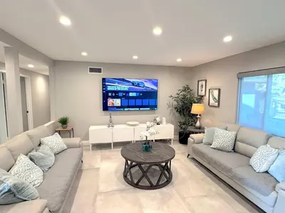 a living room with two couches and a tv at Cypress Villa Disneyland 8 Bedroom 4Bath Pool Game in Anaheim
