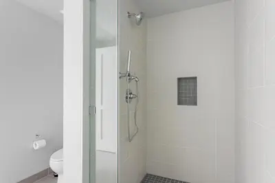 a bathroom with a glass shower with a toilet at Hollywood 1br w gym pool nr studios LAX-1036 in Los Angeles