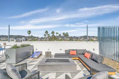 a living room with a couch and chairs on a roof at Hollywood 1br w gym pool nr studios LAX-1036 in Los Angeles
