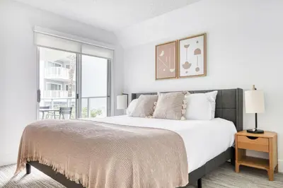 a white bedroom with a large bed and a window at Redondo Beach 1BR w Pool Gym WD nr Beach LAX-615 in Redondo Beach