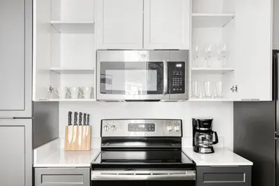 a kitchen with a stove and a microwave at Redondo Beach 1BR w Pool Gym WD nr Beach LAX-615 in Redondo Beach