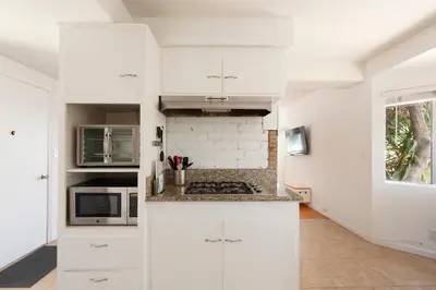a white kitchen with white cabinets and a window at 30 PCT OFF! Malibu Peaceful Getaway, Beach, Ocean in Malibu