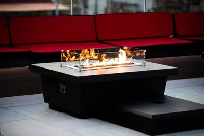 a fire pit in front of a couch at SW Beach Hotel in Hermosa Beach